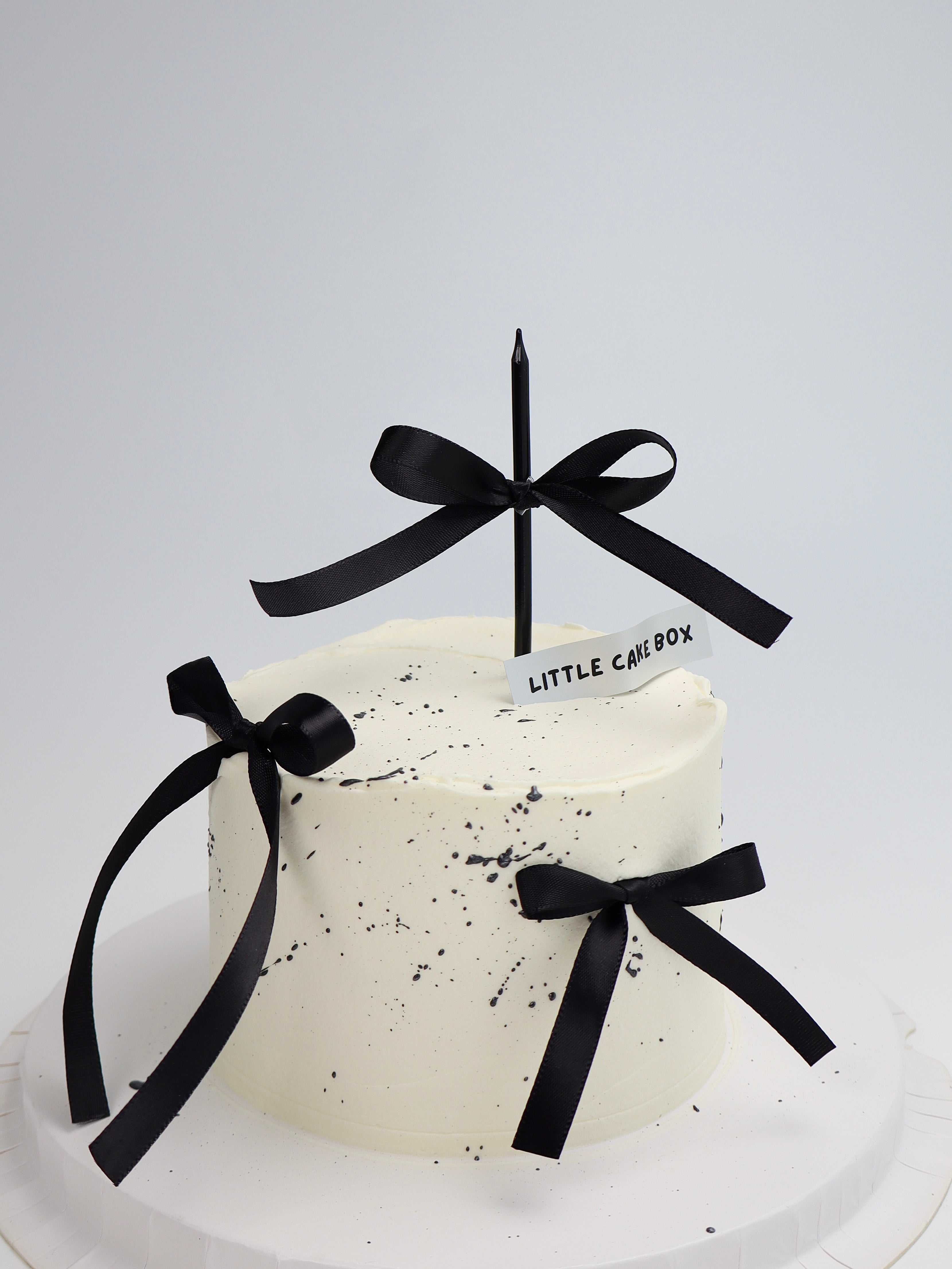 Triple Black Ribbon Cake